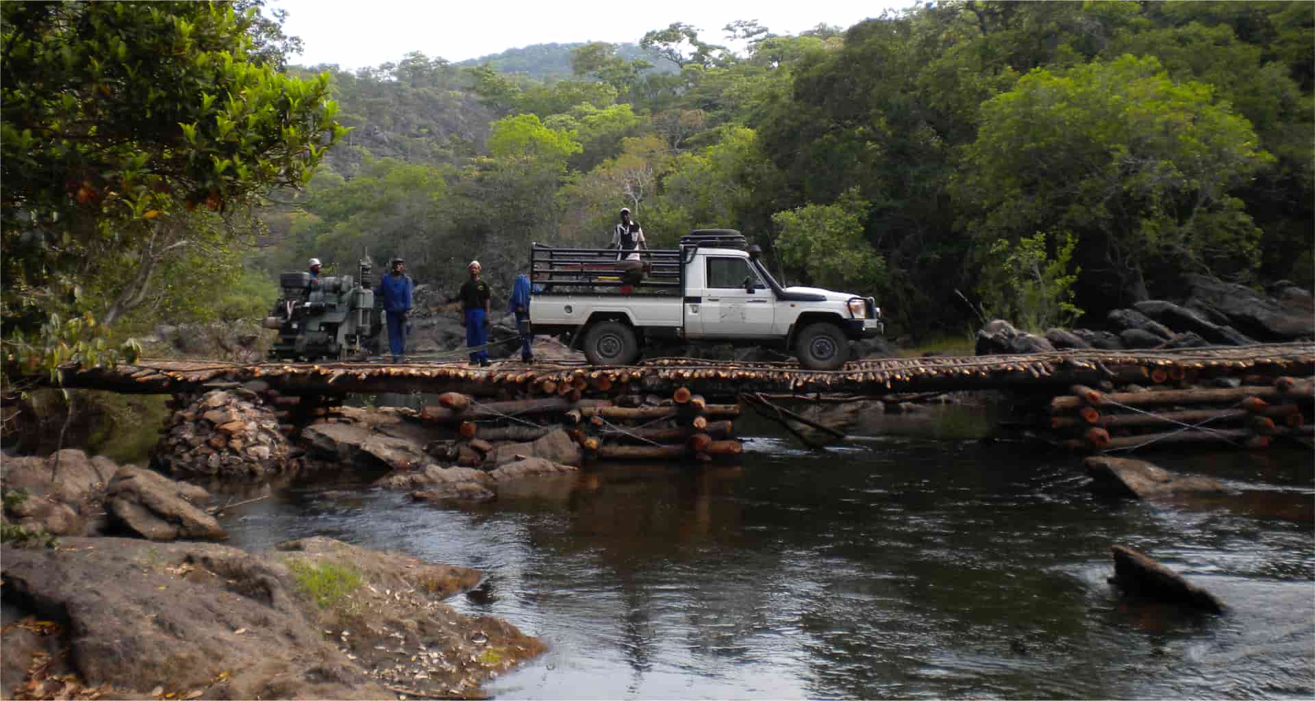 Crossing a selfmade bridge in Zambia, 2009